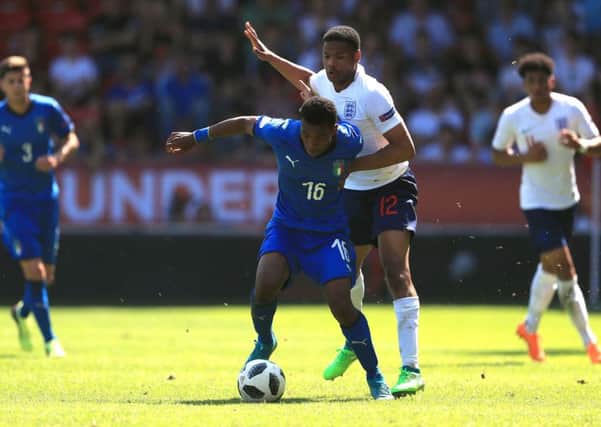 England's Vontae Daley-Campbell (right) and Italy's Jean Freddi Pascal Greco battle for the ball.