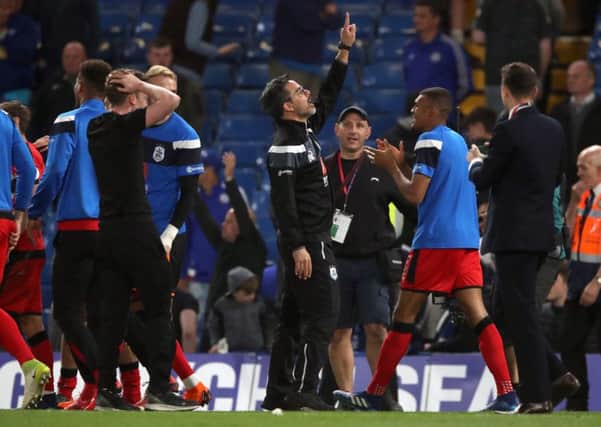 Huddersfield Town manager David Wagner (centre) celebrates at Stamford Bridge. Picture: John Walton/PA