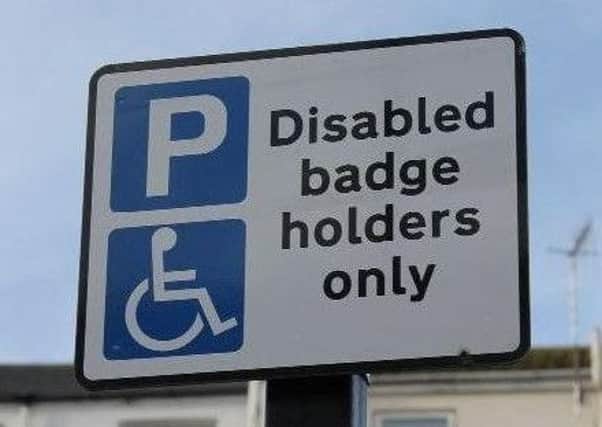 A disability parking sign.