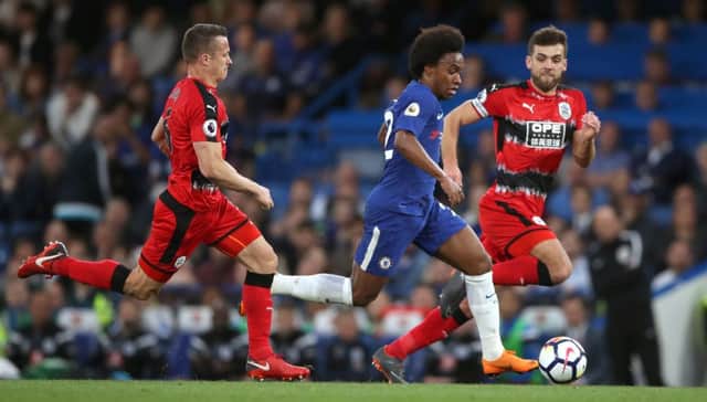 Huddersfield Town captain Tommy Smith, right, and team-mate Jonathan Hogg try to contain Chelsea's Willian at Stamford Bridge on Wednesday (Picture: John Walton/PA Wire).