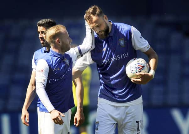 Sheffield Wednesday striker Atdhe Nuhiu holds onto the match ball after scoring a hat-trick against Norwich City in early April (Picture: Steve Ellis).