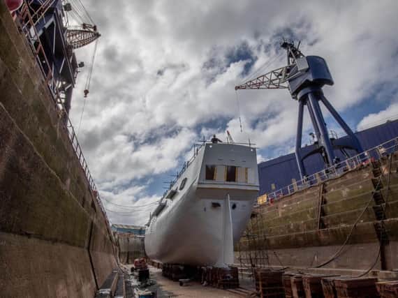 Work to refurbish the exterior of the Endeavour replica. Picture: CAG photography.