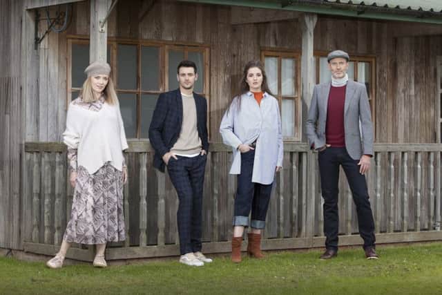 CATWALK READY: From left, modern Rarity print top, Â£130; fluid skirt, Â£130; white jumper, Â£100; JL beret, Â£35; AND/OR trainers, Â£85. Kin check suit jacket, Â£119; trousers, Â£60; white T-shirt, Â£20; JL Beige cashmere sweater, Â£85; Vans Â£41.60. KIN striped shirt, Â£69; tapered crop jeans, Â£65; red jumper, Â£49; Modern Rarity boots, Â£59; AND/OR belt, Â£35. Prince of Wales with red overcheck jacket, Â£140; jeans, Â£110; JL deep red cashmere jumper, Â£85; JL cap, Â£28; RedWing shoes, Â£160. All available at John Lewis. PIC: Doug Jackson