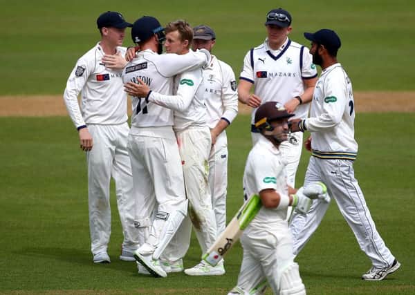 Joe Root of Yorkshire celebrates with his team-mates after dismissing Dean Elgar of Surrey during day one of the Specsavers County Championship Division One match. (Photo by Jordan Mansfield/Getty Images)