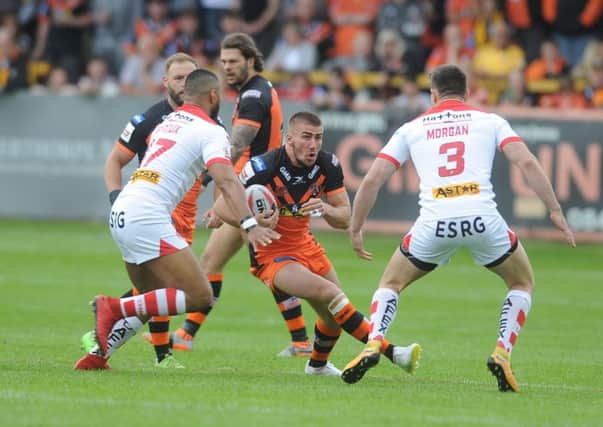 TOUGH GOING: Castleford Tigers' Greg Minkin finds his route forward blocked. Picture: Tony Johnson.