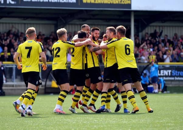 WE'RE GOING UP: Harrogate Town's Dominic Knowles celebrates his second goal of the game. Picture: Tony Johnson.