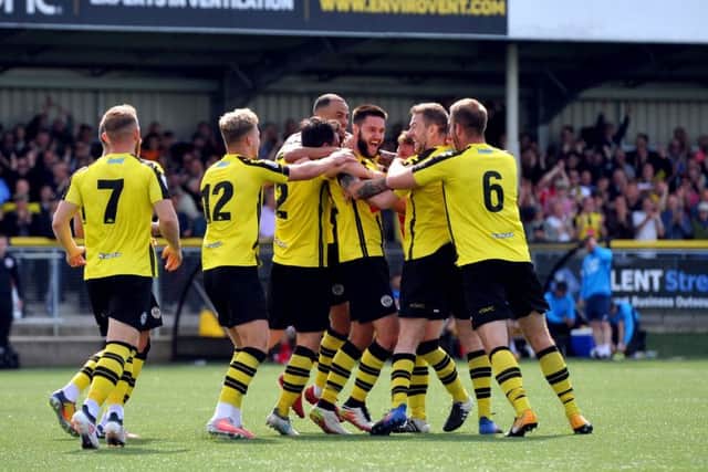 WE'RE GOING UP: Harrogate Town's Dominic Knowles celebrates his second goal of the game.  Picture: Tony Johnson.