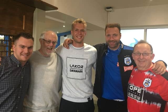 Jonas LÃ¶ssl and Laurent Depoitre pose with the trust members
