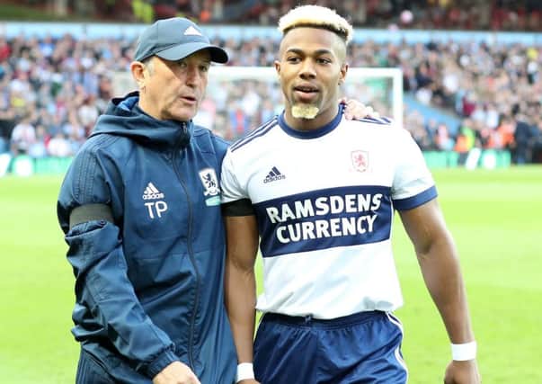 Wanted: Middlesbrough manager Tony Pulis with star man Adama Traore during the Championship play-off match at Villa Park.
