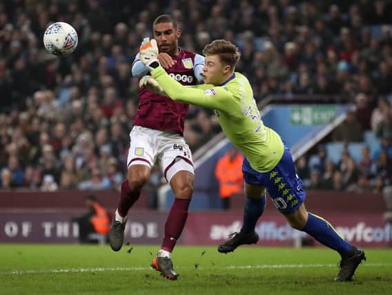 Bailey Peacock-Farrell denies Lewis Grabban during Leeds United's 1-0 defeat to Aston Villa last month.
