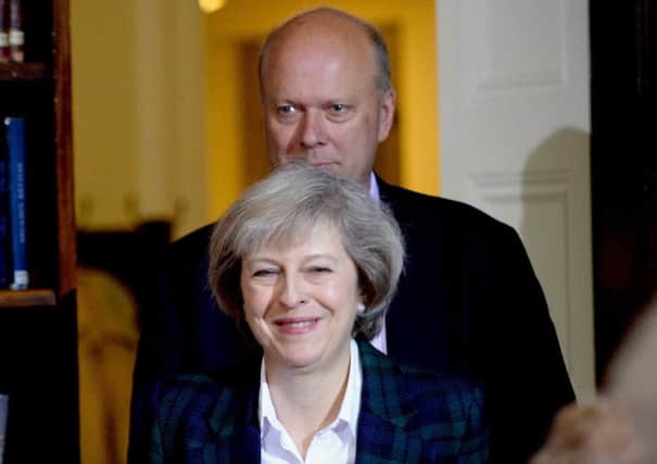 Theresa May faces fresh questions over Transport Secretary Chris Grayling.