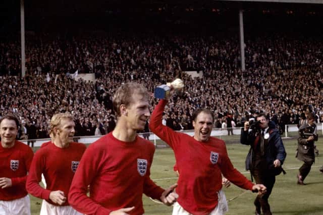 England's George Cohen, Bobby Moore, Jack Charlton and Ray Wilson (with trophy) celebrate after winning the World Cup in 1966