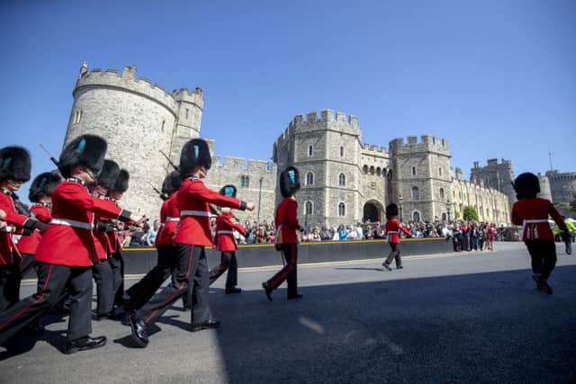 Changing of the guard at Windsor Castle as Britain puts on a show for the US