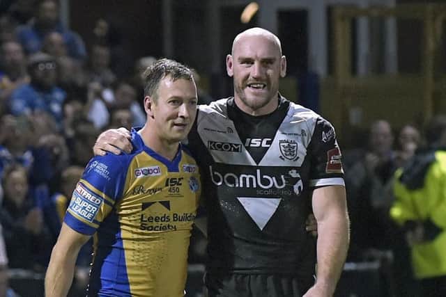 BACK IN THE FRAME: Hull FC's Gareth Ellis shares a few words with Danny McGuire after playing his final game at Headingley last year. Picture: Steve Riding.