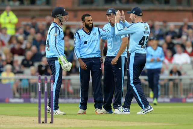 Adil Rashid, second left, celebrates taking a wicket for Yorkshire Vikings against 
Lancashire Lightning last July (Picture: Bruce Rollinson).