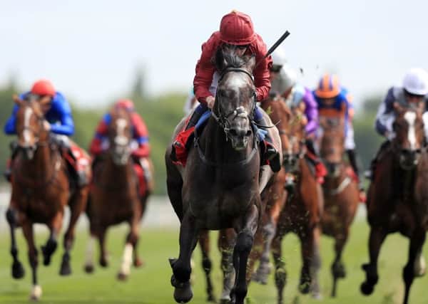 Roaring Lion and Oisin Murphy surge clear to land York's Dante Stakes.