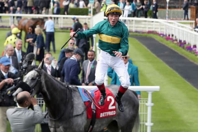 Frankie Dettori performs a flying dismount after Coronet won the Middleton Stakes.