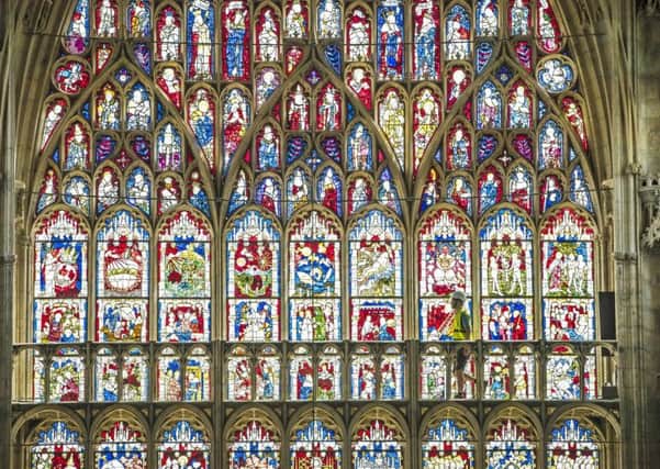 Lead Labourer Andy Bracegirdle walks in front of the 600-year old Great East Window in York Minster, as work is completed in a decade-long project to conserve and restore the largest expanse of medieval stained glass in the country.