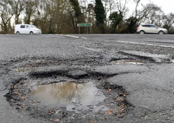 Is enough money being spent on fixing potholes?
