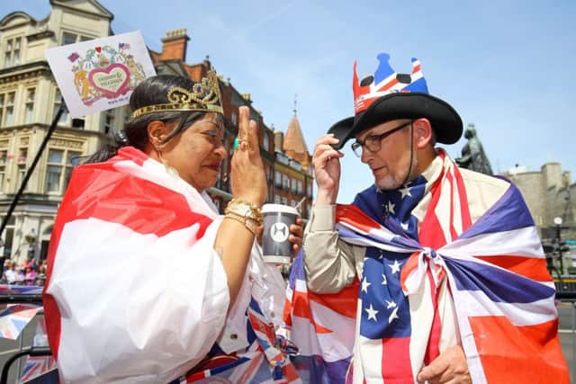 Royal fans outside Windsor Castle ahead of the wedding of Prince Harry and Meghan Markle. PIC: PA