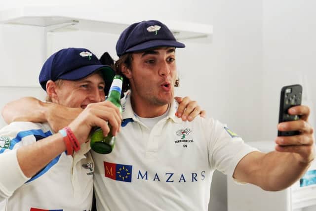 Yorkshire's Joe Root and Jack Brooks take a selfie as the players celebrate in their Division One title win in 2014. Picture: Jonathan Gawthorpe.