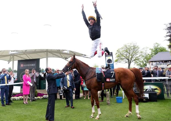 Frankie Dettori performs his flying dismount after Stradivarius won the Yorkshire Cup.