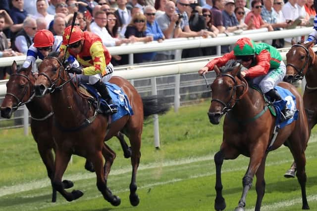 Signora Cabello ridden by Jason Hart (second right) wins the Langleys Solicitors British EBF Marygate Fillies' Stakes during day three of the 2018 Dante Festival at York Racecourse.