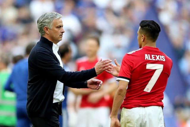 Manchester United manager Jose Mourinho (left) shakes hands with Manchester United's Alexis Sanchez (right) after the final whistle of the FA Cup final (Picture: PA)