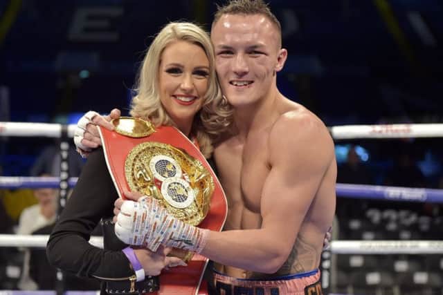 World champion: Josh Warrington with wife Natasha after his victory. Picture: Steve Riding