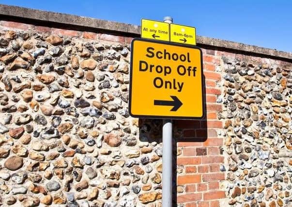 Living Streets want a ban on parking outside schools in order to ease air pollution and encourage more children to walk to school.