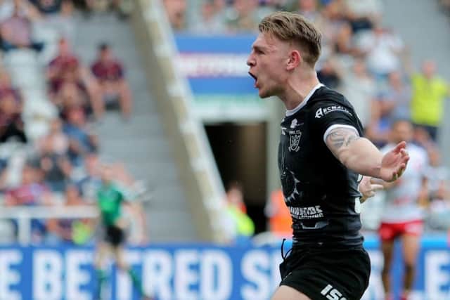 Hull Fc's Liam Harris celebrates his try.