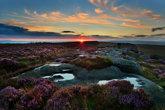 The sun sets over the flowering heather above Addingham Moorside. Picture: Bruce Rollinson