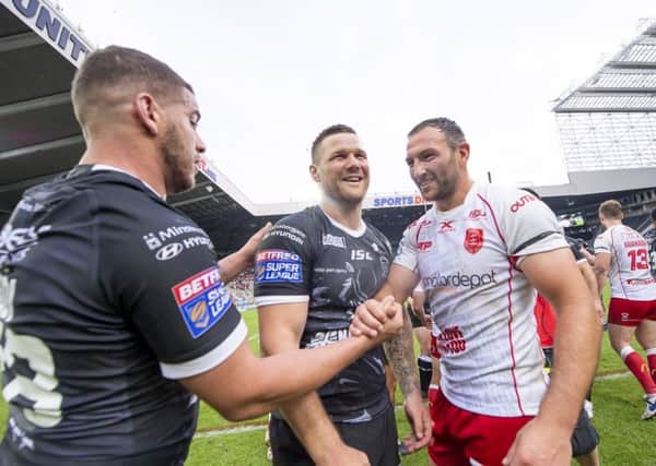 Hull FC's Hakim Miloudi and Kirk Yeaman shake hands with Hull KR's Tommy Lee. Picture by Allan McKenzie/SWpix.com