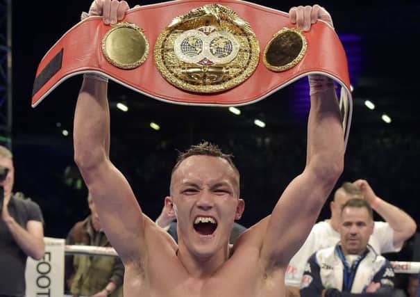 Josh Warrington holds aloft the belt after beating Lee Selby at Elland Road to win the IBF world title (Picture: Steve Riding).