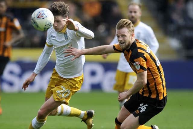 Max Clark: Hull defender, right, has attracted bids.