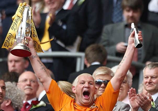 Hull City's Dean Windass lifts the Championship play off trophy after the Coca-Cola Championship Play Off Final at Wembley Stadium, London. (Picture: PA)