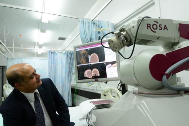 The ROSA surgical assistant robot could transform the lives of thousands of people needing complex brain surgery. Pictured is Sheffield consultant neurosurgeon Dev Bhattacharyya. Picture: Scott Merrylees