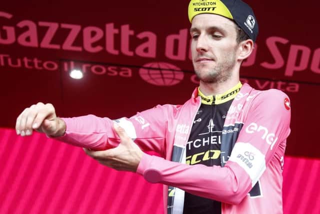 British rider Simon Yates puts his overall's leader pink jersey on the podium at the end of the 159 km seventh stage of the 101th Giro d'Italia. (Picture: LUK BENIES/AFP/Getty Images)