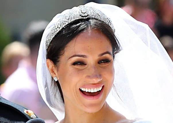 GET THE LOOK: Meghan Markle kept her bridal look natural for both hair and make-up, teaming a slightly undone low chignon with a soft pink beige semi gloss lip. Try MAC's Amplified Lipstick in Blankety (Â£17.50) Picture: Gareth Fuller/PA Wire