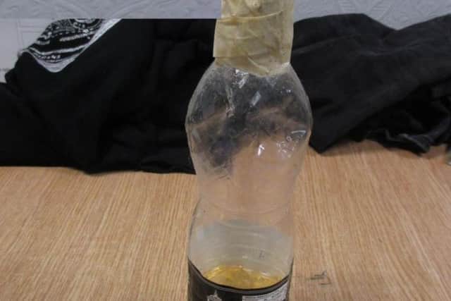 A bottle of flammable liquid. Photo: North Yorkshire Police