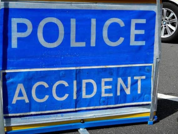 Police have closed part of the A63 after a lorry hit a footbridge and shed its load.