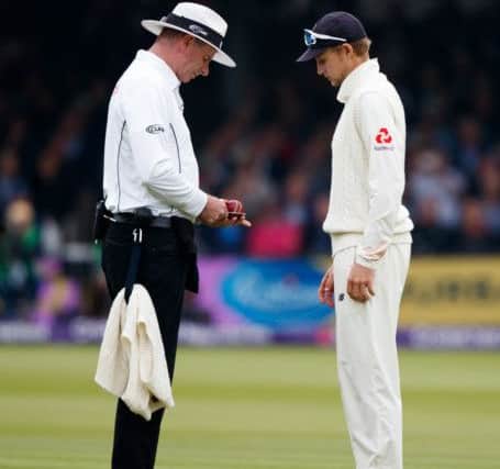 England's captain Joe Root asks the umpire to check the shape of the ball on day two at Lord's. Picture: John Walton/PA