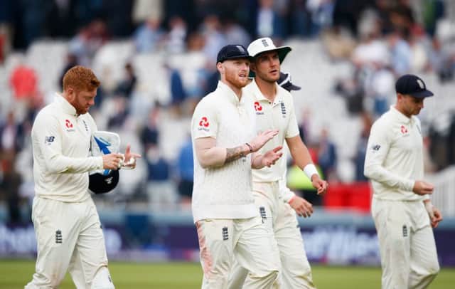 DROPPING BEHIND: England's Jonny Bairstow, left, Ben Stokes and Stuart Broad walk off the pitch at stumps on day two at Lord's. Picture: John Walton/PA