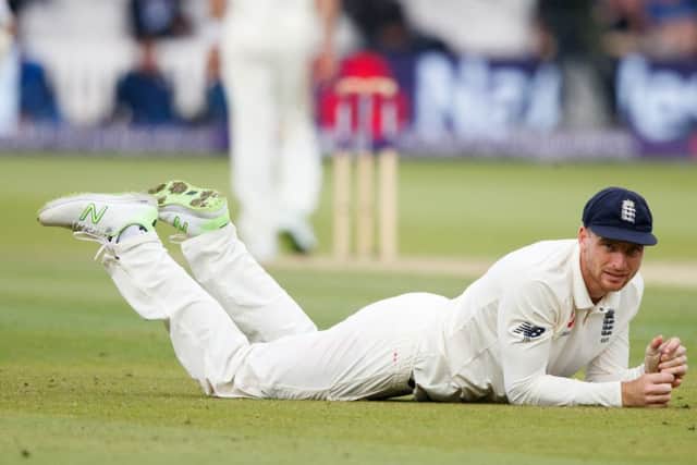 England's Jos Buttler looks up after a ball went past his grasp  on day two at Lord's. Picture: John Walton/PA.