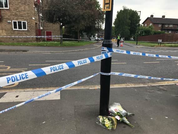People have begun to leave floral tributes to murder victim, Sam Baker