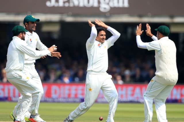 Pakistan's Mohammad Abbas (centre) celebrates taking the wicket of England's Alastair Cook during day three at Lord's. Picture: Adam Davy/PA.