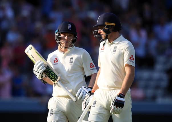 England's Dom Bees (left) and Jos Buttler (right) walk off at the end of day three at Lord's.  Picture: Adam Davy/PA