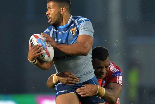In top form: Giants' Kruise Leeming is held by Salford's Rob Lui.
 Picture: Bruce Rollinson