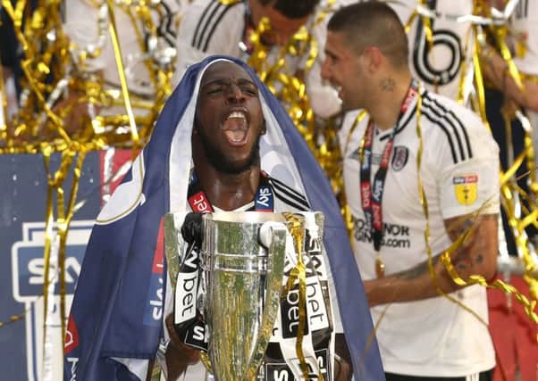 Fulham's Aboubakar Kamara with the trophy.