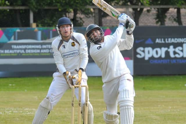 Clearing the ropes: Townville's Shahid Nawaz struck two sixes out of the ground for Townville before bowled by Pudsey St Lawrnece's Chris Marsden. Picture: Steve Riding